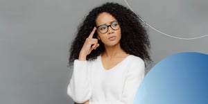Woman wearing white shirt and glasses with thinking pose 