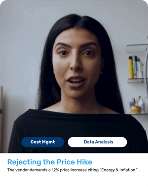 Woman in her 30s with long dark hair, wearing a black professional top. Firm, neutral expression.